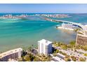 Breathtaking aerial view showcasing the condo, bridge, and sparkling waterfront scenery at 80 Rogers St # 6D, Clearwater, FL 33756