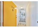 Condo hallway leading to the main living area showcasing tile flooring and neutral walls at 8931 Blind Pass Rd # 262, St Pete Beach, FL 33706