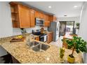 Well-appointed kitchen with granite countertops, stainless steel appliances, and ample cabinet space at 108 Biscayne Ave # B, Tampa, FL 33606