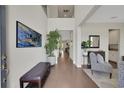 Inviting foyer features hardwood floors, high ceilings, and access to staircase at 10945 Sundrift Dr, Tampa, FL 33647