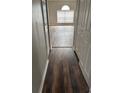 Hallway featuring new floors and neutral paint leads to living areas with natural light at 11102 Summer Star Dr, Riverview, FL 33579