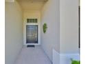 Welcoming entryway featuring a classic front door and neutral-toned exterior at 11408 Coventry Grove Cir, Lithia, FL 33547
