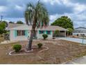 Charming single-story home featuring a long driveway and carport at 1509 Cherry Hills Dr, Sun City Center, FL 33573