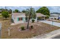 Charming single-story home featuring a long driveway and carport at 1509 Cherry Hills Dr, Sun City Center, FL 33573