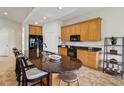 A kitchen with a breakfast bar, tile floors, and bright, contrasting colors at 1532 Citrine Trl, Tarpon Springs, FL 34689