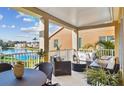 Inviting patio with comfortable seating overlooking a tranquil lake and lush landscaping with a water fountain feature at 18 Franklin S Ct # D, St Petersburg, FL 33711