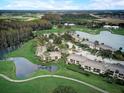 An aerial view of the condo community with lakes and golf course at 29129 Bay Hollow Dr # 3201, Wesley Chapel, FL 33543