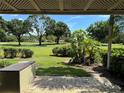 Covered patio featuring views of the landscaped grounds at 29129 Bay Hollow Dr # 3201, Wesley Chapel, FL 33543