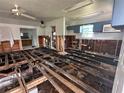 Interior view showing subfloor and studs, providing an opportunity to renovate at 3007 Clinton S St, Gulfport, FL 33707