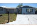 Inviting single-story home with well-maintained yard, walkway and covered entry at 3424 Truman Dr, Holiday, FL 34691