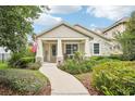 Charming one-story home boasts a cozy front porch, well-maintained landscaping, and a welcoming entrance at 6005 Shell Ridge Dr, Lithia, FL 33547