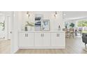 Stylish dining area with white cabinets, quartz countertops and modern decor at 6404 Monterey Blvd, Tampa, FL 33625