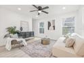 Bright living room boasts recessed lighting, and plenty of natural light creating an inviting and airy atmosphere at 7 Hamilton Heath Dr, Tampa, FL 33604