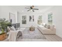 Inviting living room with a comfortable couch and chair, neutral tones and plenty of natural light at 7 Hamilton Heath Dr, Tampa, FL 33604