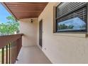 Private balcony with a view and outdoor lighting fixture at 1200 Tarpon Woods Blvd # M8, Palm Harbor, FL 34685