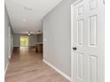 Inviting hallway with wood flooring leading to living area at 1200 Tarpon Woods Blvd # M8, Palm Harbor, FL 34685