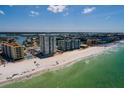A picturesque beach scene with modern condos and direct access to pristine sands at 17408 Gulf Blvd # 203, Redington Shores, FL 33708