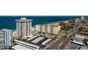 A coastal community with a high-rise condo, pool, parking, and beach access at 17408 Gulf Blvd # 203, Redington Shores, FL 33708