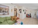 Inviting living room with a cozy green sofa and open access to other rooms at 2627 8Th N Ave, St Petersburg, FL 33713