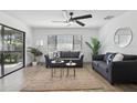 Bright living room with neutral tones, stylish furnishings, and ample natural light at 2725 Countryside Blvd # 103, Clearwater, FL 33761