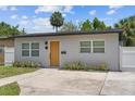 Charming home with a modern front door, well-maintained lawn, and lush landscaping at 3151 6Th S Ave, St Petersburg, FL 33712