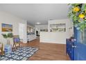 Bright and airy living room with hardwood floors and a stylish blue accent rug at 4103 W Bay Villa Ave, Tampa, FL 33611