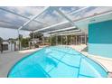 This home has a beautiful screened-in pool with a view of the canal at 4643 Bay Crest Dr, Tampa, FL 33615