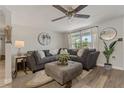 Bright and airy living room featuring a comfortable sectional sofa and natural light at 7909 Canna Dr, Port Richey, FL 34668