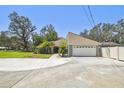 Spacious home featuring an attached two-car garage and extended driveway at 11203 Killearn Ct, Riverview, FL 33569