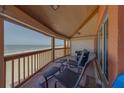 Relaxing balcony space with lounge chairs, seating, and ocean vistas at 17606 Lee Ave, Redington Shores, FL 33708