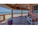 Inviting balcony featuring comfortable seating and ocean views at 17606 Lee Ave, Redington Shores, FL 33708