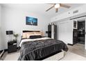 A spacious main bedroom with a ceiling fan and natural light at 219 4Th N Ave # 201, St Petersburg, FL 33701