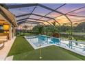 Covered pool area with putting green at 2641 Whittler Br, Odessa, FL 33556