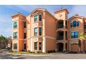 Exterior view of a multi-story condo building featuring private balconies at 2722 Via Tivoli # 430A, Clearwater, FL 33764