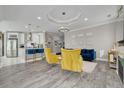 Open-concept living area with modern decor, hardwood floors, and natural light at 2722 Via Tivoli # 430A, Clearwater, FL 33764