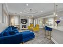 Bright living room featuring stylish modern furniture, fireplace, and hardwood floors at 2722 Via Tivoli # 430A, Clearwater, FL 33764