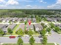 Aerial view of a residential neighborhood, showcasing lush greenery and well-spaced homes at 3757 Villamore Ln, Odessa, FL 33556