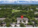Wonderful aerial shot showcases the townhouse community and convenient street parking at 4732 Ashburn Pond Way, Tampa, FL 33610