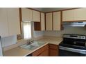 Functional kitchen featuring ample countertop space, and stainless steel appliances at 4736 Sunny Loop, Holiday, FL 34690