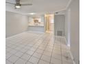 Spacious living room featuring tile flooring and neutral wall paint at 4801 W Mcelroy Ave # D104, Tampa, FL 33611