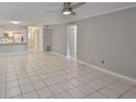 Open floor plan featuring tile flooring and a ceiling fan at 4801 W Mcelroy Ave # D104, Tampa, FL 33611