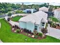 Lovely home featuring fenced yard, beautiful landscaping, charming architecture, and a well-maintained roof at 500 Westborough Ln, Safety Harbor, FL 34695