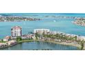 Aerial view of waterfront condos with tropical landscaping and lakefront property and the intercoastal waterway at 6105 Bahia Del Mar Cir # 683, St Petersburg, FL 33715