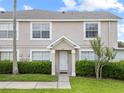 Charming townhome showcasing lush landscaping and a welcoming front entrance at 659 Kensington Lake Cir, Brandon, FL 33511