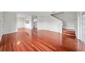 Light-filled living room with gleaming hardwood floors and open floor plan at 659 Kensington Lake Cir, Brandon, FL 33511