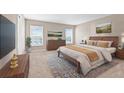 Serene main bedroom with neutral tones, plush carpeting, and bright natural light at 6937 Gideon Cir, Zephyrhills, FL 33541