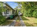 Long driveway that leads to a detached garage at 702 W Virginia Ave, Tampa, FL 33603