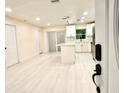 Spacious kitchen features white cabinets, modern appliances, and a large island at 733 Holly Ter, Brandon, FL 33511