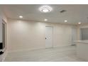 Bright and airy living room boasting recessed lighting, updated flooring at 733 Holly Ter, Brandon, FL 33511