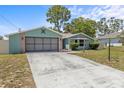 Lovely one-story home with an attached garage, showcasing a manicured lawn and inviting curb appeal at 10512 Red Coach St, Spring Hill, FL 34608